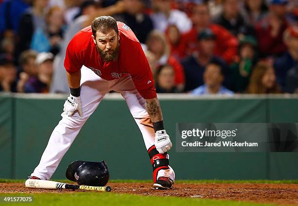 Mike Napoli of the Boston Red Sox stands at home plate after striking out against the Detroit Tigers during the game at Fenway Park on May 16, 2014...