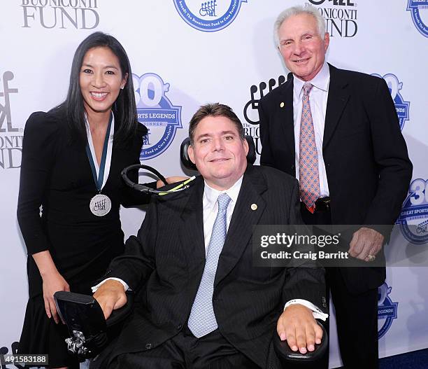 Michelle Kwan, Marc Buoniconti and Nick Buoniconti attend the 30th Annual Great Sports Legends Dinner to benefit The Buoniconti Fund to Cure...