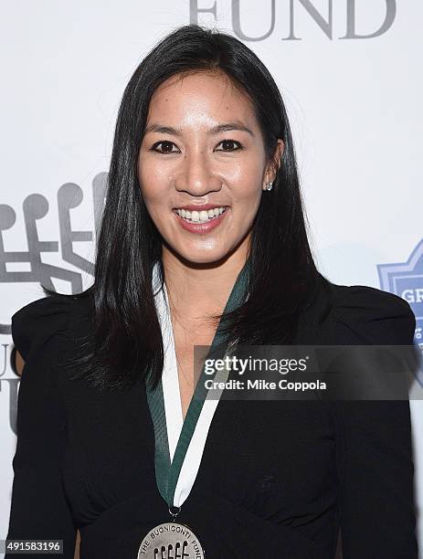 Figure skater Michelle Kwan attends the 30th Annual Great Sports Legends Dinner to benefit The Buoniconti Fund to Cure Paralysis at The Waldorf...