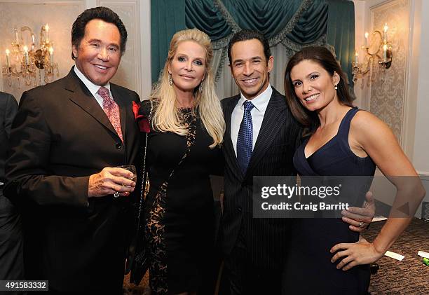 Wayne Newton, Kathleen McCrone, Helio Castroneves and Adriana Henao attend the 30th Annual Great Sports Legends Dinner to benefit The Buoniconti Fund...
