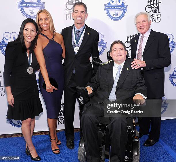 Michelle Kwan, Nada Stepovich, John Stockton, Marc Buoniconti and Nick Buoniconti attend the 30th Annual Great Sports Legends Dinner to benefit The...