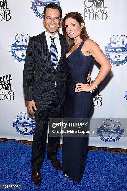 Auto Racing Driver Helio Castroneves and his wife Adriana Henao attend the 30th Annual Great Sports Legends Dinner to benefit The Buoniconti Fund to...