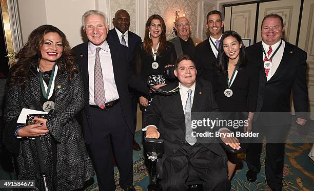 Orianne Collins-Mejjati, Nick Buoniconti, Harry Carson, Jennifer Capriati, Marc Buoniconti, Dann Florek Jorge Posada, Michelle Kwan and Chip Ganassi...