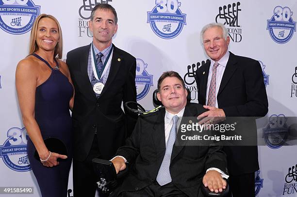 Nada Stepovich, John Stockton, Marc Buoniconti and Nick Buoniconti attend the 30th Annual Great Sports Legends Dinner to benefit The Buoniconti Fund...