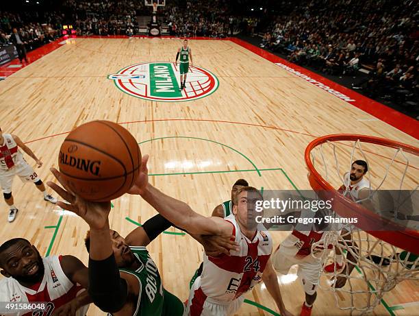 Robbie Hummel of Emporio Armani Milano blocks the shot of Jared Sullinger of the Boston Celtics as part of the 2015 Global Games on October 6, 2015...