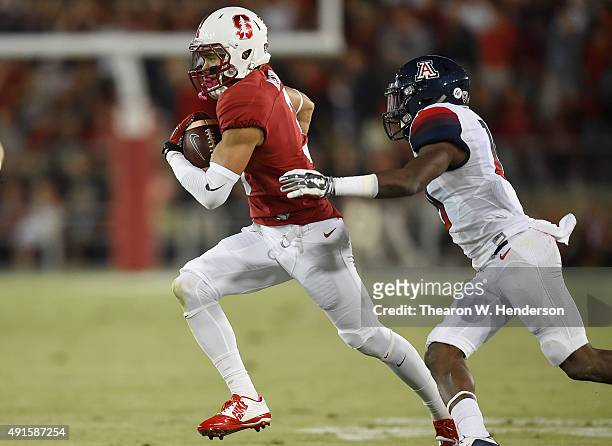 Michael Rector of the Stanford Cardinal catches a forty two yard pass over DaVonte' Neal of the Arizona Wildcats in the second quarter of an NCAA...