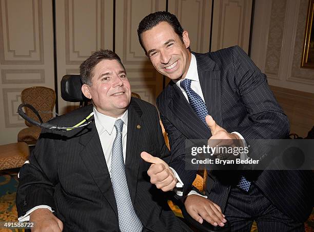 Marc Buoniconti and Auto Racing Driver Helio Castroneves attend the 30th Annual Great Sports Legends Dinner to benefit The Buoniconti Fund to Cure...