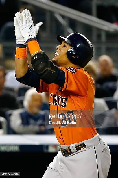 Carlos Gomez of the Houston Astros celebrates after hitting a solo home run in the fourth inning against Masahiro Tanaka of the New York Yankees...