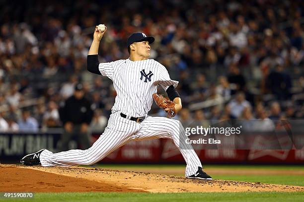 Masahiro Tanaka of the New York Yankees throws a pitch against the Houston Astros during the American League Wild Card Game at Yankee Stadium on...