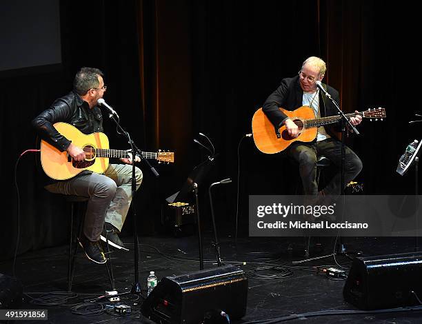 Vince Gill and Paul Simon perform onstage at The Country Music Hall Of Fame & Museum All For The Hall New York Benefit Concert at PlayStation Theater...