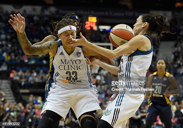 Seimone Augustus and Anna Cruz of the Minnesota Lynx go after a loose ball during the fourth quarter in Game Two of the 2015 WNBA Finals against the...
