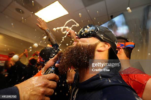 Dallas Keuchel of the Houston Astros celebrate with his teammates in the locker room after defeating the New York Yankees in the American League Wild...
