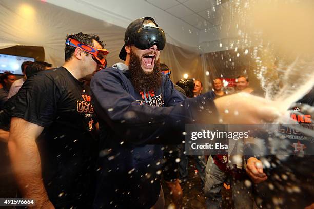 Dallas Keuchel of the Houston Astros celebrate with his teammates in the locker room after defeating the New York Yankees in the American League Wild...