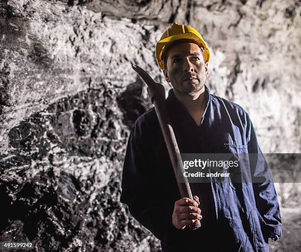 man working at a mine - miner pick stock pictures, royalty-free photos & images