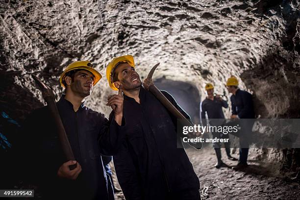 men working at the mine - miner pick stock pictures, royalty-free photos & images