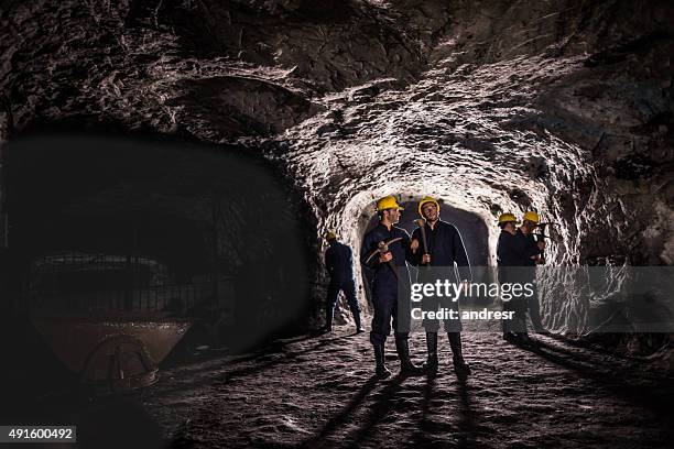 group of miners working at a mine - miner pick stock pictures, royalty-free photos & images