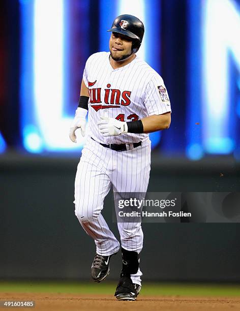 Josmil Pinto of the Minnesota Twins rounds the bases after hitting a solo home run against the Seattle Mariners during the fourth inning of the game...