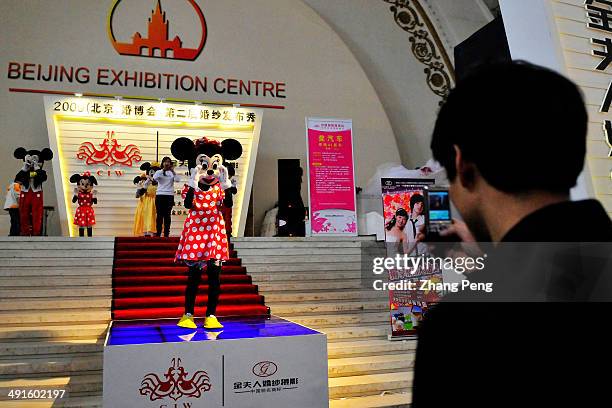 Wedding service promotion by Mickey Mouse at an annual wedding services exhibition in Beijing. Chinese lovers who prepare for marriage now compete...