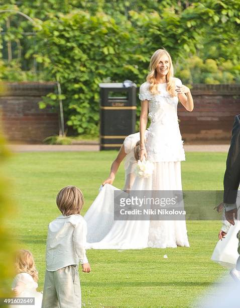 Poppy Delevingne and Cara Delevingne are seen at Poppy Delevingnes and James Cook's wedding reception held in Kensington Palace Gardens on May 16,...