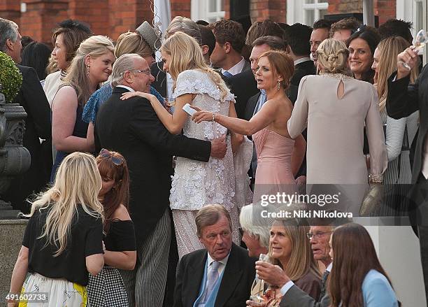 Poppy Delevingne and Geri Halliwell are seen at Poppy Delevingnes and James Cook's wedding reception held in Kensington Palace Gardens on May 16,...