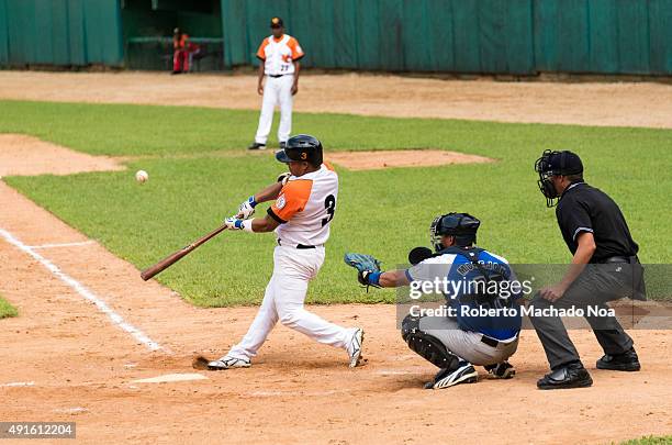 Cuban baseball classic: Industriales vs Villa Clara in the stadium Sandino. Frank Morejon plays catcher for Industriales and Andy Zamora bats for...