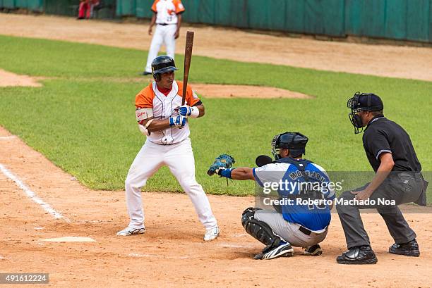 Cuban baseball classic: Industriales vs Villa Clara in the stadium Sandino. Frank Morejon plays catcher for Industriales and Andy Zamora bats for...