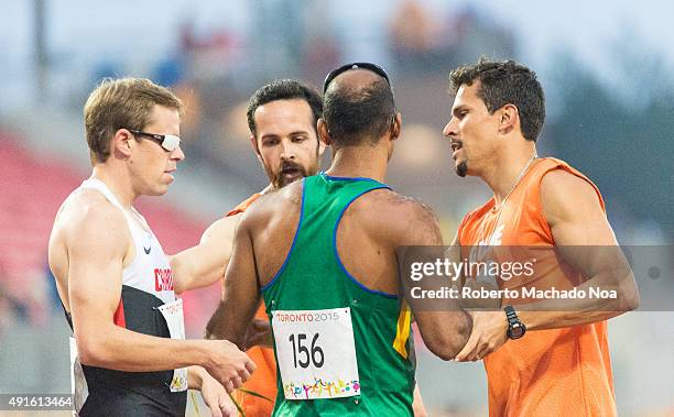 Visually challenged athletes from Brazil and USA with their guides, interacting with each other at the 2015 Parapan American Games. The 2015 Parapan...