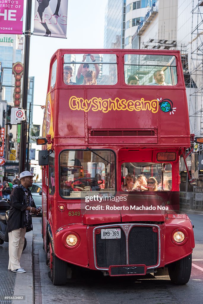 Red colour double-deck open top City Sightseeing tourist bus...