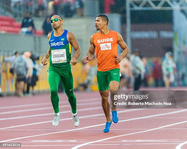 Visually challenged Brazillian athlete running the race with the help of his guide at the 2015 Parapan American Games. The 2015 Parapan American...
