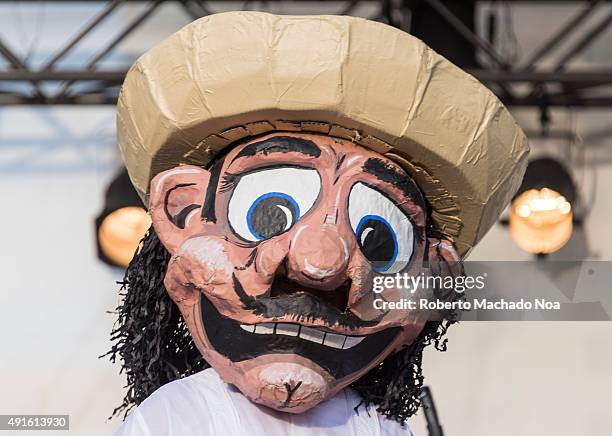 Person dressed as cartoon character standing on stage entertaining the crowd at MexFest 2015 in Toronto. MexFest 2015 is celebration of all things...