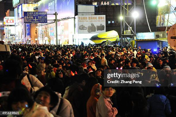 Christmas shoppers and revellers on Wangfujing Street in Beijing. Now Christmas has become one of the most popular holidays for youngsters in China.