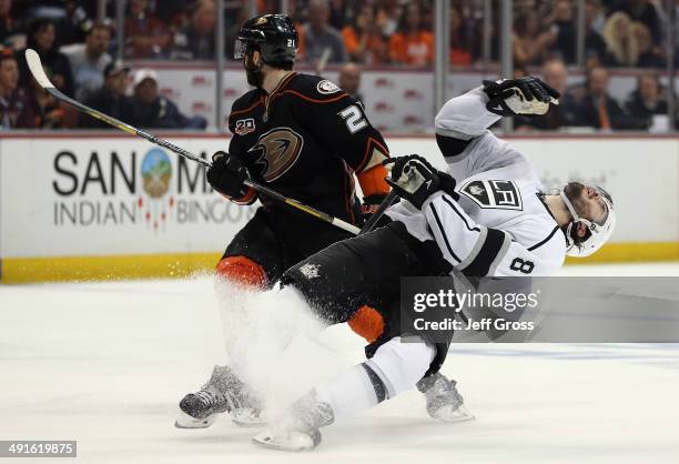 Drew Doughty of the Los Angeles Kings is elbowed by Kyle Palmieri of the Anaheim Ducks in the third period of Game Seven of the Second Round of the...