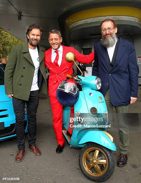 Chef Carlo Cracco, Founder and president of Italia Independent Lapo Elkann and architect Michele De Lucchi pose during the presentation of Garage...