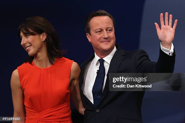 British Prime Minister David Cameron and wife Samantha Cameron stand on stage after Mr Cameron's keynote speech on the fourth and final day of the...