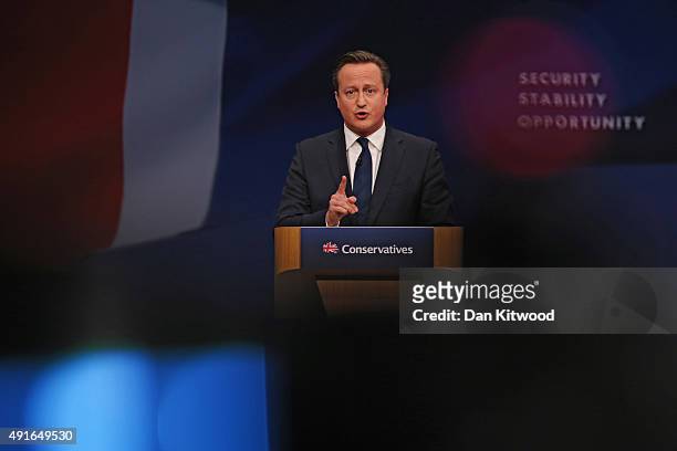 British Prime Minister David Cameron gives his keynote speech to delegates on the fourth and final day of the Conservative Party Conference, at...