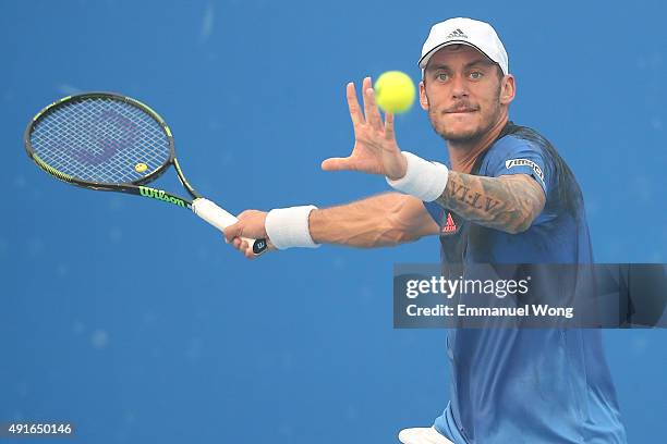 Andreas Haider-Maurer of Austria returns a ball against Jack Sock of the United States during the day five of the 2015 China Open at the China...