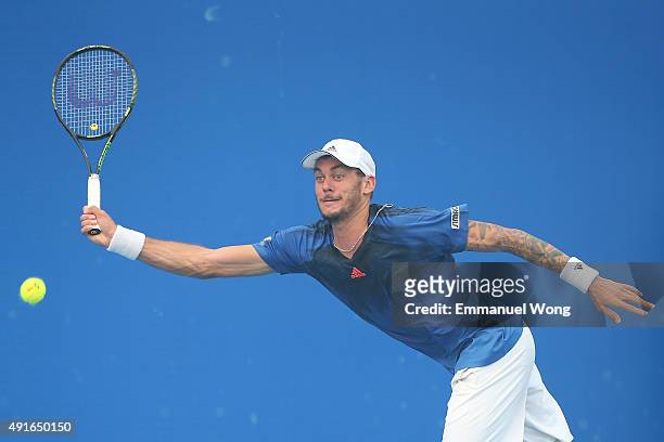Andreas Haider-Maurer of Austria returns a ball against Jack Sock of the United States during the day five of the 2015 China Open at the China...
