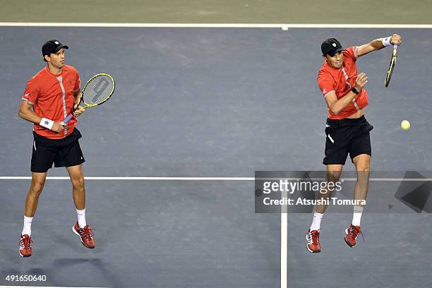 Bob Bryan and Mike Bryan of USA compete against Juan Sebastian Cabal and Robert Farah of Colombia during the men's doubles first round match on day...