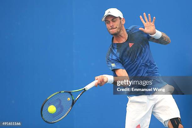 Andreas Haider-Maurer of Austria returns a ball against Jack Sock of the United States during the day five of the 2015 China Open at the China...