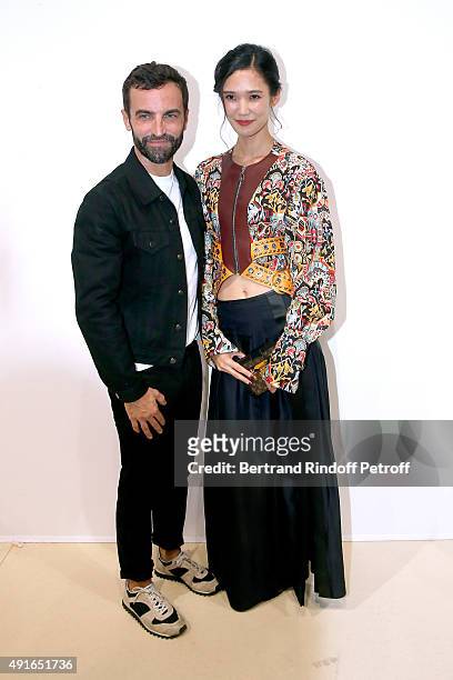 Fashion Designer Nicolas Ghesquiere and Model Tao Okamoto pose Backstage after the Louis Vuitton show as part of the Paris Fashion Week Womenswear...