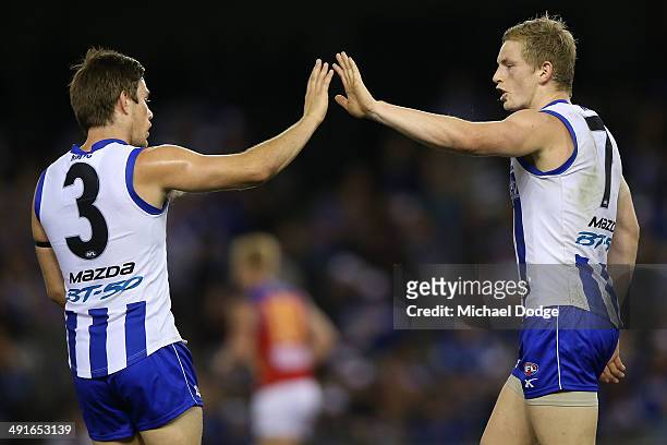 Ryan Bastinac and Jack Ziebell of the Kangaroos celebrate a goal during the round nine AFL match between the North Melbourne Kangaroos and the...