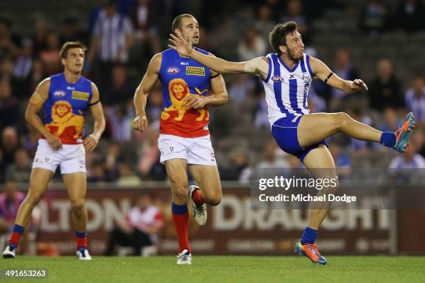 Sam Wright of the Kangaroos kicks the ball for a goal during the round nine AFL match between the North Melbourne Kangaroos and the Brisbane Lions at...