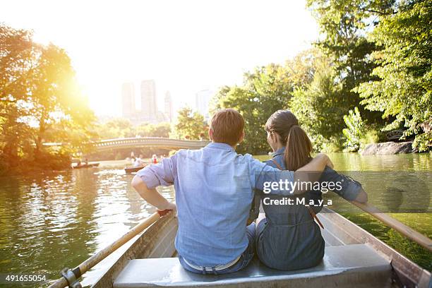 romantic couple on boat - couple central park stockfoto's en -beelden