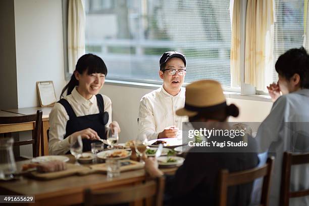 friends sharing a meal in cafe at the early aftern - meal ストックフォトと画像