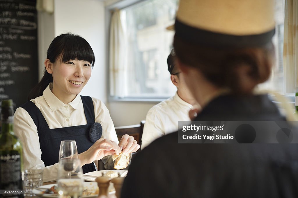 Friends sharing a meal in the cafe in the early af