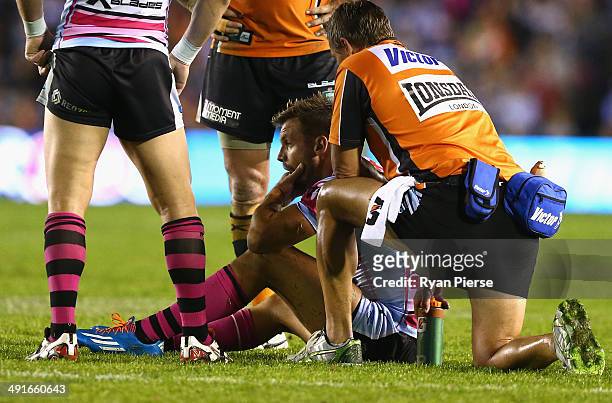 Beau Ryan of the Sharks injures his arm during the round 10 NRL match between the Cronulla-Sutherland Sharks and the Wests Tigers at Remondis Stadium...