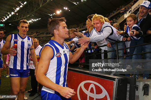 Andrew Swallow of the Kangaroos celebrates the win with fans during the round nine AFL match between the North Melbourne Kangaroos and the Brisbane...
