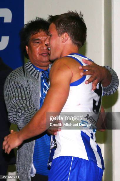 Andrew Swallow of the Kangaroos celebrates the win with Phil Krakouer during the round nine AFL match between the North Melbourne Kangaroos and the...