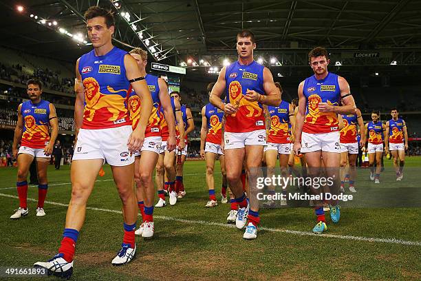 Jed Adcock Jonathan Brown and Pearce Hanley of the Lions walk off after their defeat during the round nine AFL match between the North Melbourne...