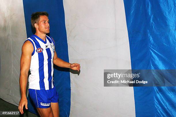 Andrew Swallow of the Kangaroos walks back to the rooms after the win during the round nine AFL match between the North Melbourne Kangaroos and the...